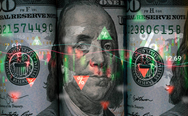 istock Benjamin Franklin face on USD dollar banknote with stock market chart and up down arrow for analysis investment on currency exchange or forex and economy inflation concept. 1692271742