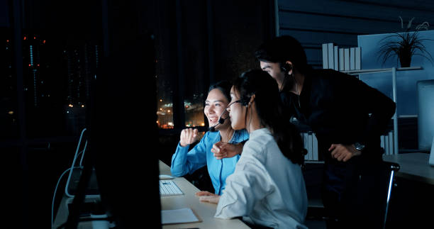 istock Call center employees work in groups at night. Service available 24 hours a day. 1692272895