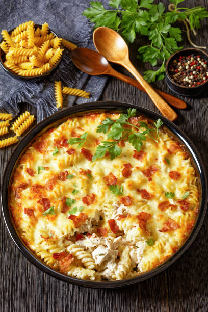 istock fusilli pasta bacon cheese chicken bake, top view 1692275212