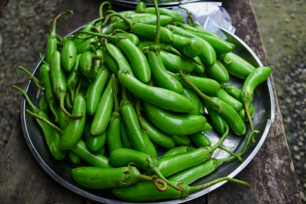 istock Long eggplant for sale at market stall 1692276337