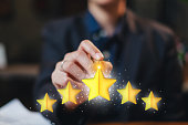 hand pointing at five star rate, review or feedback. Concept of online reviewing, satisfaction, customer review, best quality, good service. Excellent work evaluation. Online survey.
