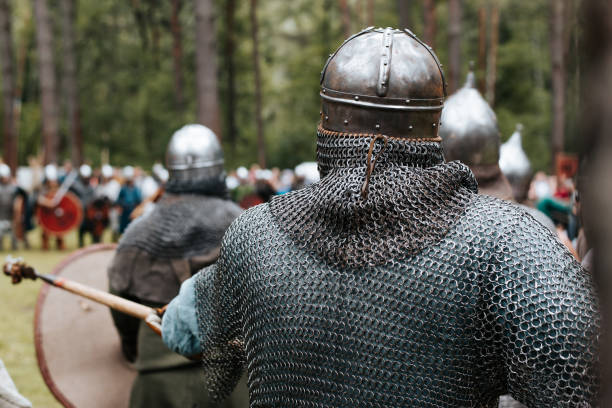 istock Back view warriors knights with a spear going on the attack outdoors, middle ages 1692279847