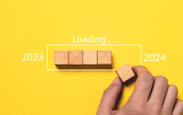 istock Hand assemble wooden block cube to update progress 2023 to 2024 for countdown and preparation new year change and start new business target strategy concept. 1692282056