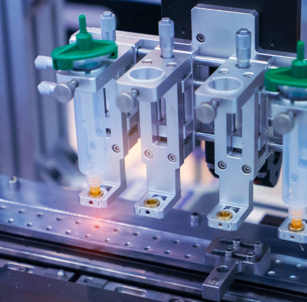 istock High precision and technology of nozzle device and needle of automatic glue dispenser machine (glue injection) at factory 1692289652