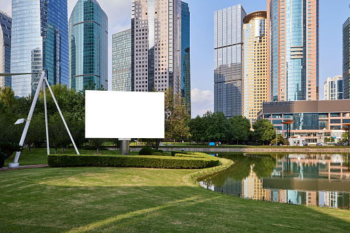 Blank billboards in urban green spaces