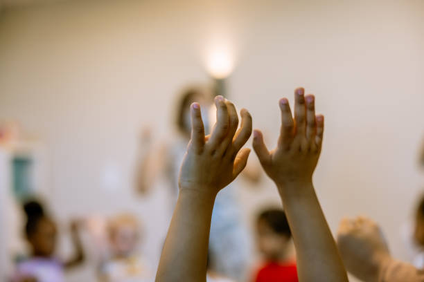 istock A child's hands raised in the air 1692292472