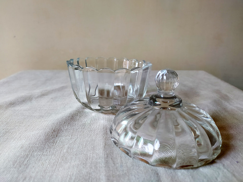 A glass sugar pot with glass cover for serving sugar in it