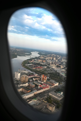 View from the plane when landing on an industrial city