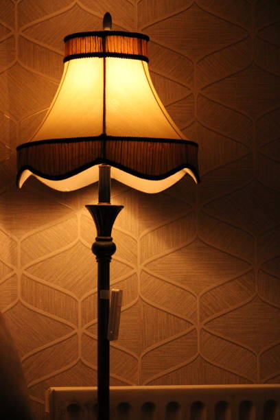 istock Cozy Home Interior with Warm Yellow Lamp Light 1692310394