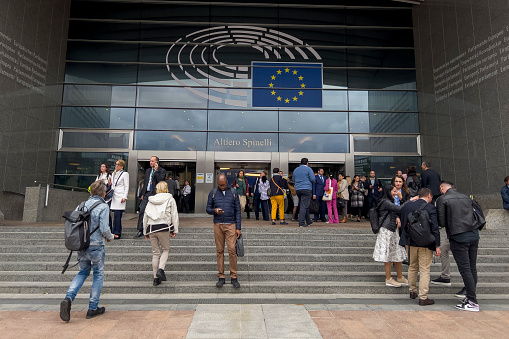 People walk outside of the European Parliament in Brussels, Belgium on September 20, 2023.