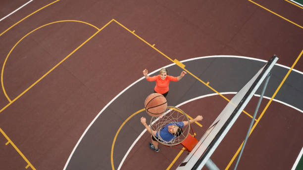 istock High Angle view Couple playing basketball 1692318468