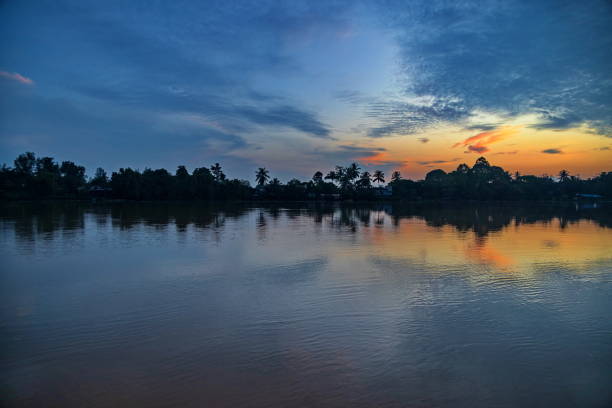 Sunrise at Kinabatangan river, Borneo Island Colorful calm sunrise at Kinabatangan river, Borneo Island, Malaysia kinabatangan river stock pictures, royalty-free photos & images