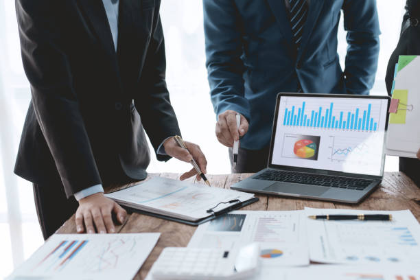 istock Business representatives meeting and planning graph presentation on laptop computer. Business team discussing investment plan using data on laptop. 1692320750