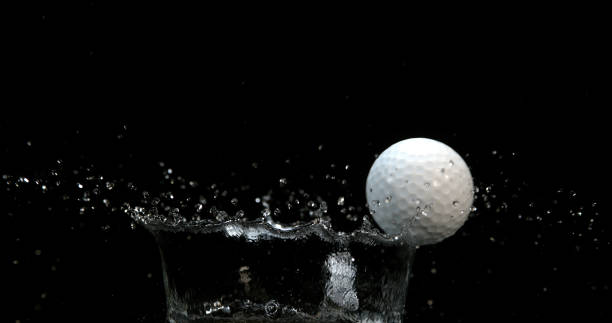 istock Golf's Ball Falling into Water against Black background 1692324952
