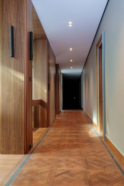 istock Corridor in a building with modern design with parquet flooring. Interior design 1692329368