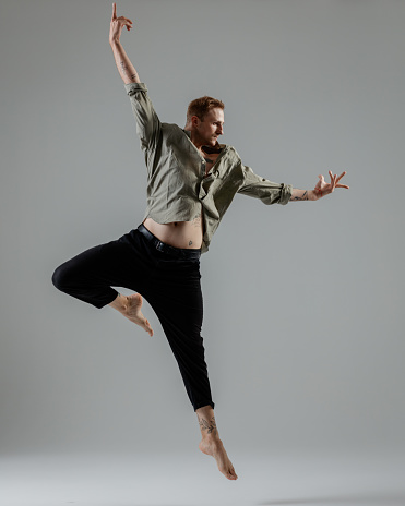 Modern Male Dancer on gray background