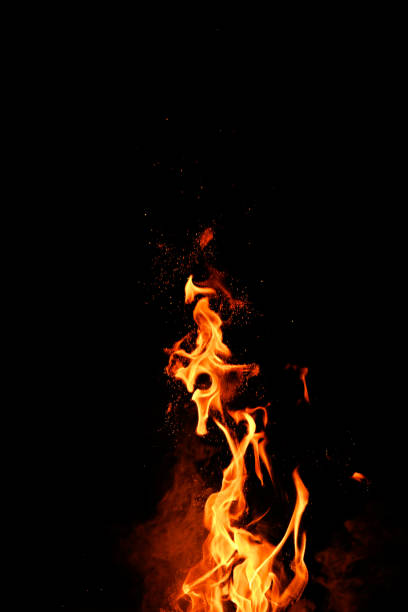 istock Blazing flame of fire on black background 1692342419
