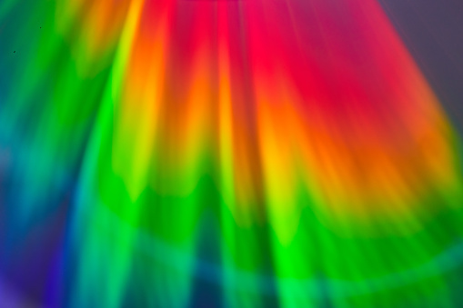 Image of Abstract rainbow aurora lights with brilliant reds and bright green fading to dark purple