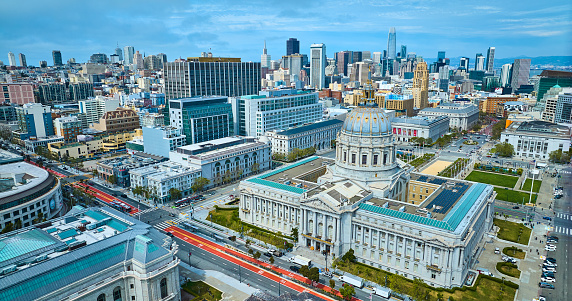 Image of Aerial of government buildings with focus on city hall and view of San Francisco skyscrapers