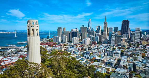 Image of Aerial of San Francisco skyscrapers view from beside Coit Tower with distant Oakland Bay Bridge