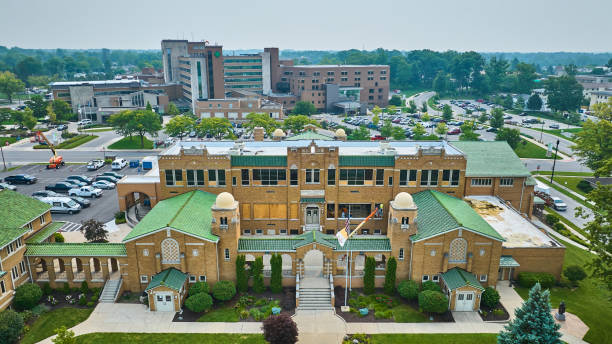 istock Aerial St Jude Catholic school with windows boarded up and under construction and Parkview hospital 1692369623