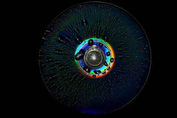 Blank music CD with multicolored sound equalizer wave line and flying musical notes against black background.