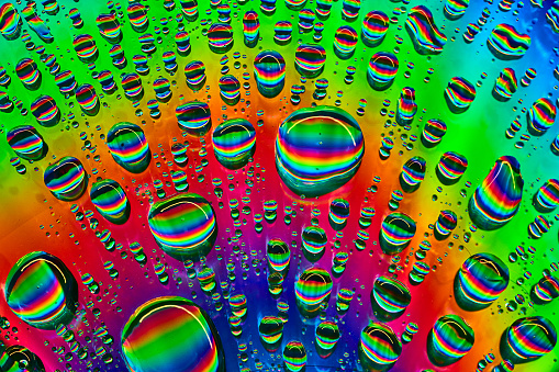 Image of Brilliant burst of rainbow colors in bubbles in abstract background asset