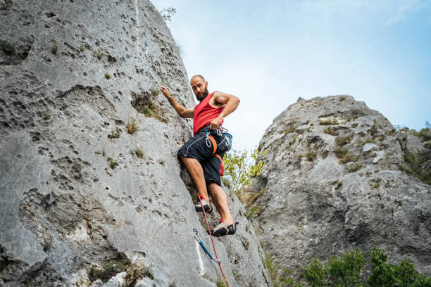 istock Climber making his way up a rock 1692374999