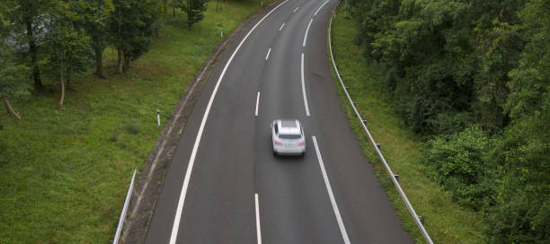 istock White car driving fast through the city. 1692384229