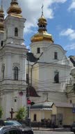 istock Vinnitsa city Ukraine Central street Orthodox Church against the background of a cloudy beautiful light sky travel bus rides a lot of traffic cars 1692385796