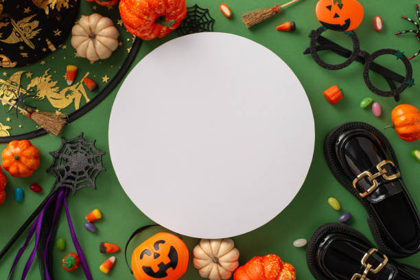 istock Delight in the magic of Halloween night celebration with this top-down image capturing witch attributes, Halloween-themed decor on a green isolated background, designed for text or advert integration 1692386521