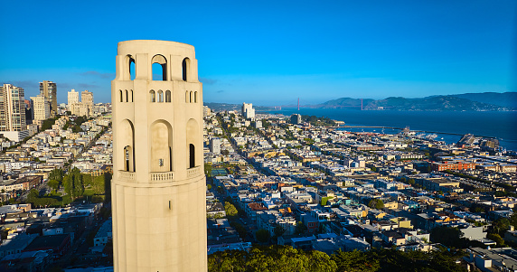 Image of Top of Coit Tower aerial late afternoon view of city and distant Golden Gate Bridge