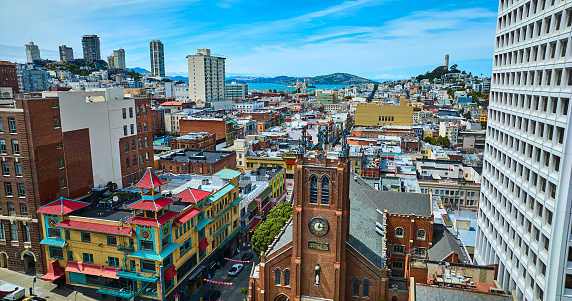 Image of View of Chinatown from drone aerial with distant San Francisco Bay and Coit Tower