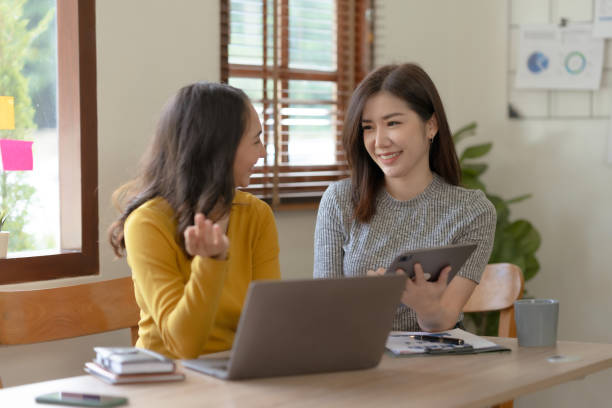 istock Two Asian businesswoman discussing concept presentation start project Planning analysis and financial statistics and investment market at office. 1692403400