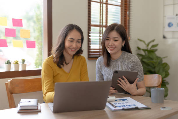 istock Two Asian businesswoman discussing concept presentation start project Planning analysis and financial statistics and investment market at office. 1692403410