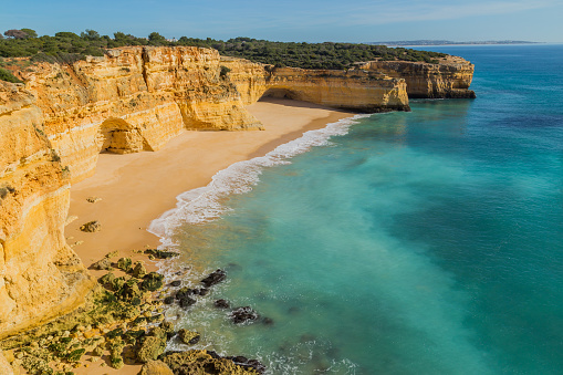 Waves at famous beach of Praia da Marinha. This beach is a part of famous tourist region of Algarve.