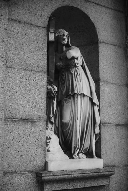 istock Statue in cemetery on mausoleum 1692417351
