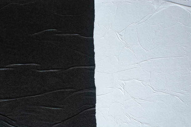 istock Black and white sheets of paper as an abstract background. 1692417929