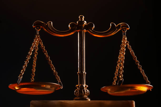 istock Balance scale isolated on black background. 1692418512