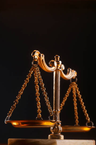 istock Balance scale isolated on black background. 1692418555