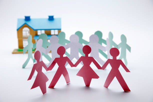 Diversity, inclusion, adoption concept. Colorful paper cut figure yellow background