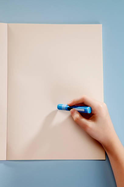 istock Human hand holding a crayon, ready to draw. 1692435340