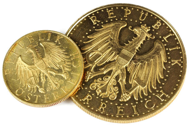 istock Austrian 25 and 100 Schilling gold coins 1692447614