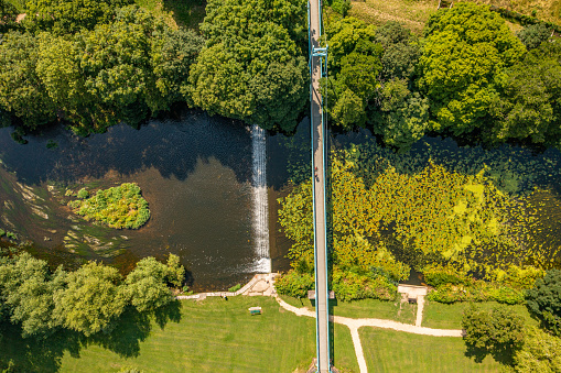 Aerial photo from a drone of a bridge crossing The River Stour in Blandford Forum, Dorset, England.