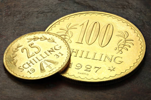 istock Austrian 25 and 100 Schilling gold coins 1692449484