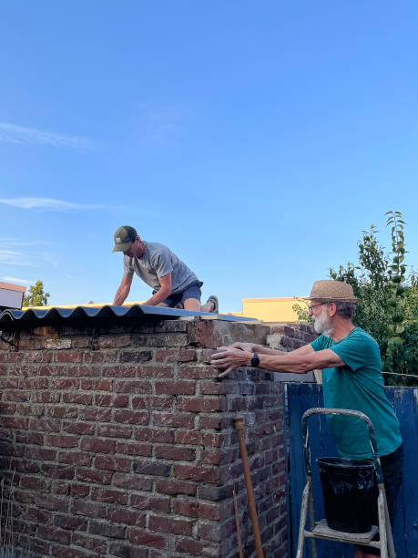 istock Roofers renovating a barn 1692449520