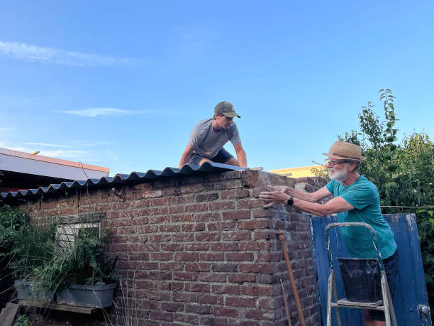 istock Roofers renovating a barn 1692449522