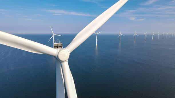 istock offshore windmill park with clouds and a blue sky 1692452448