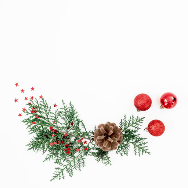 istock Merry Christmas composition with tree branches and red balls with confetti on white background. Flat lay, top view 1692466232
