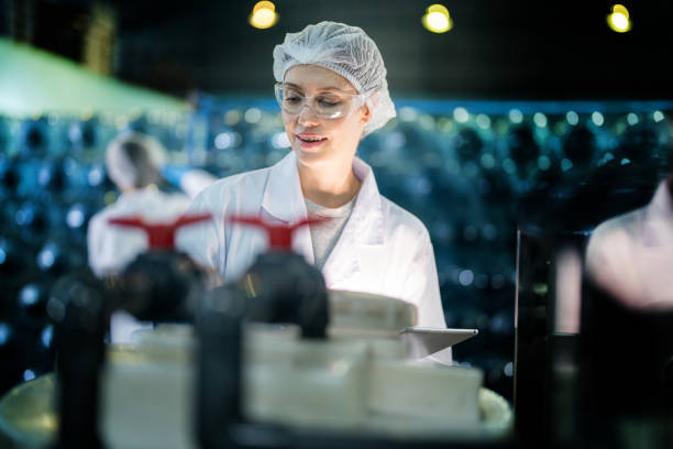 istock scientist worker checking the quality of Reverse osmosis machine system at the industrial factory. Female worker recording data at the control panel with measure pressure for recycle portable plant. 1692467410